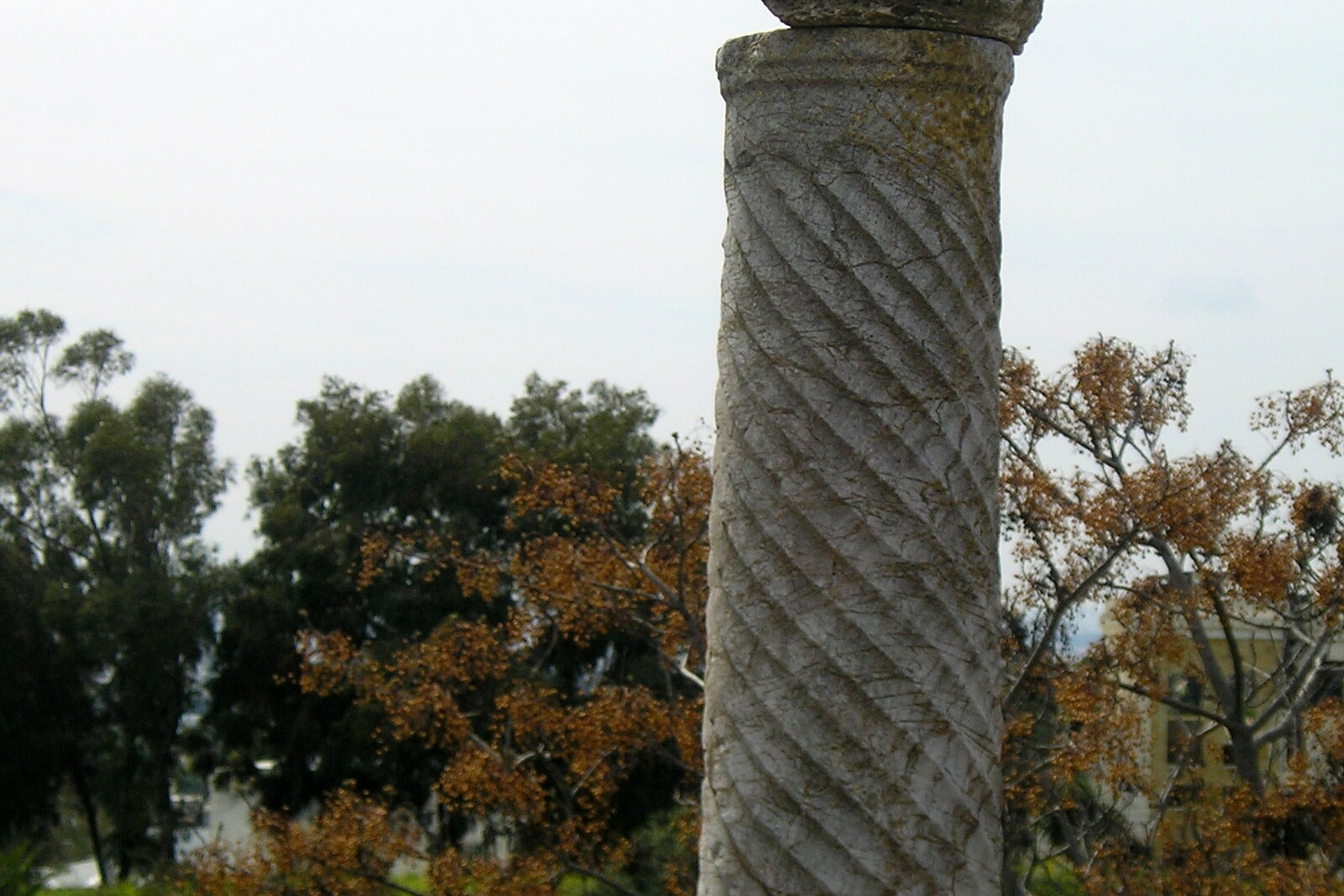 Stone foundations and columns on a slope in Roman Villas Park.