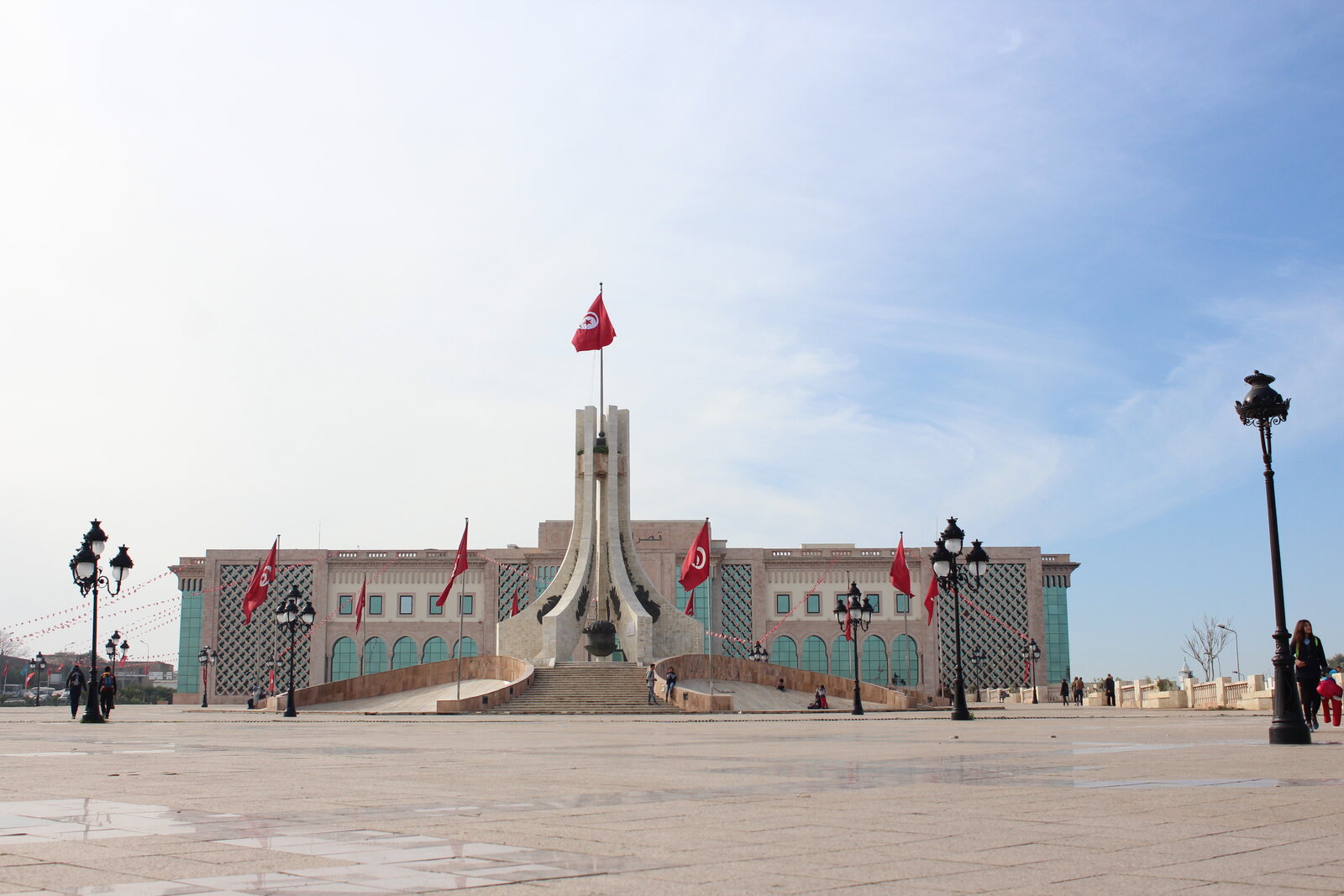 Open Kasbah Square with a central monument and the flag of Tunis.