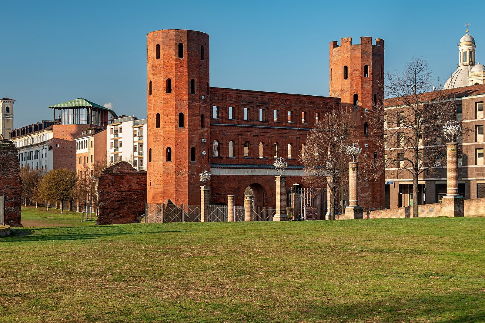 Brick towers and arches of the Roman Palatine Gate.