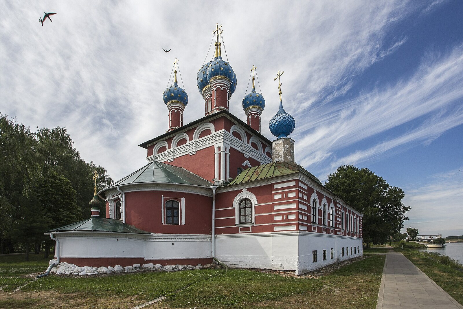 The red Church of Tsarevich Dmitry on the Blood with blue domes in the Uglich Kremlin.