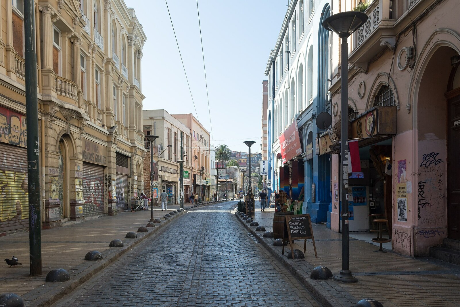 Serrano Street with a dense line of historic commercial buildings.