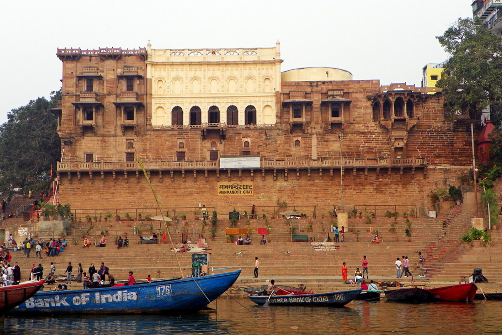 Man Mandir Ghat and the haveli above the Ganges in Varanasi, viewed from the river.