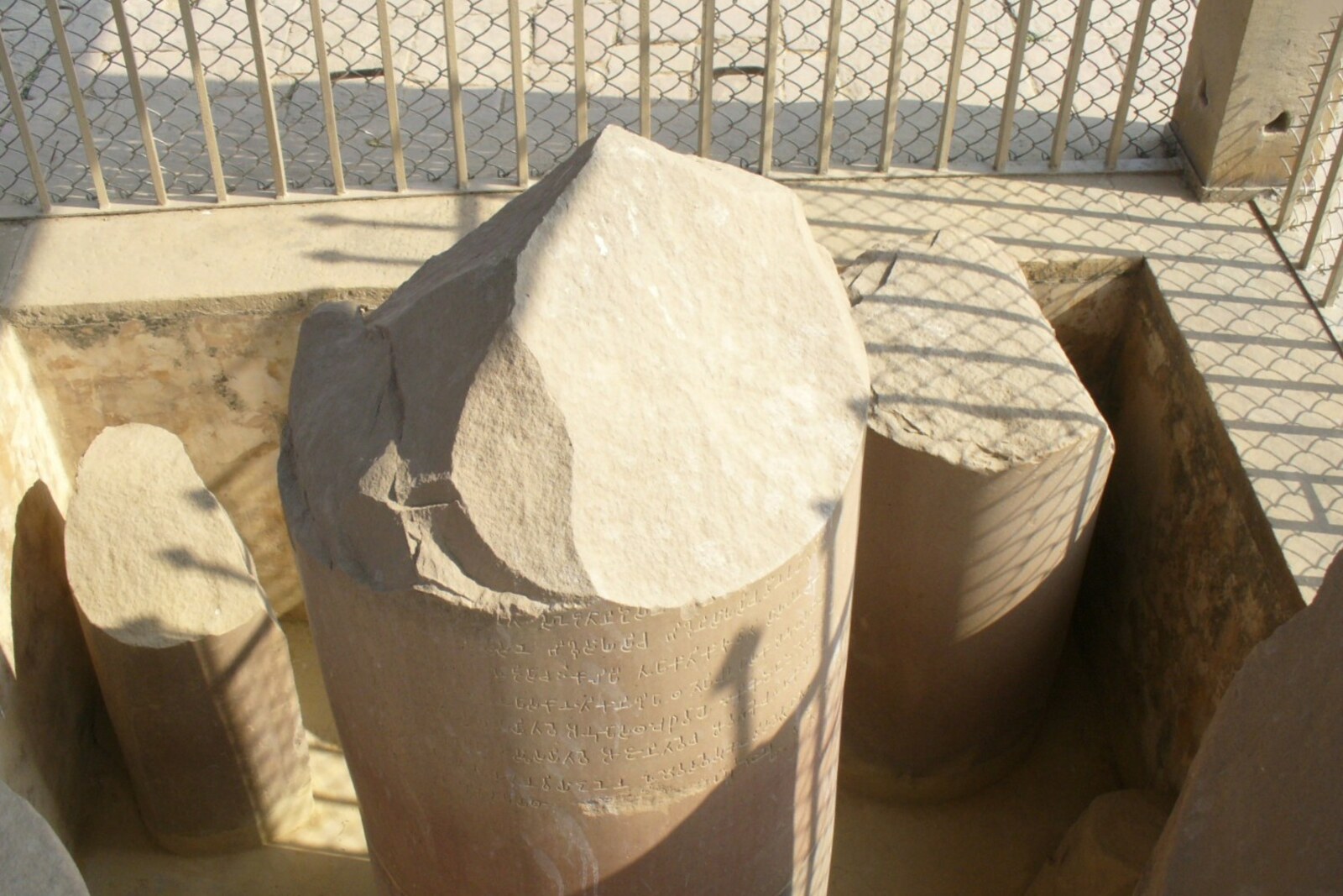 The base and remains of the Ashoka Pillar in the Sarnath archaeological zone.