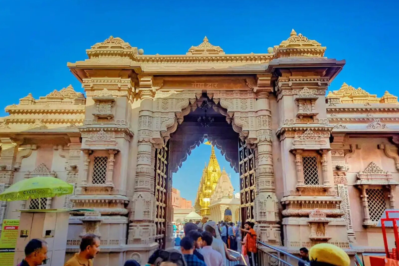 Wide sandstone gates of the Kashi Vishwanath Dham corridor with steps and arches