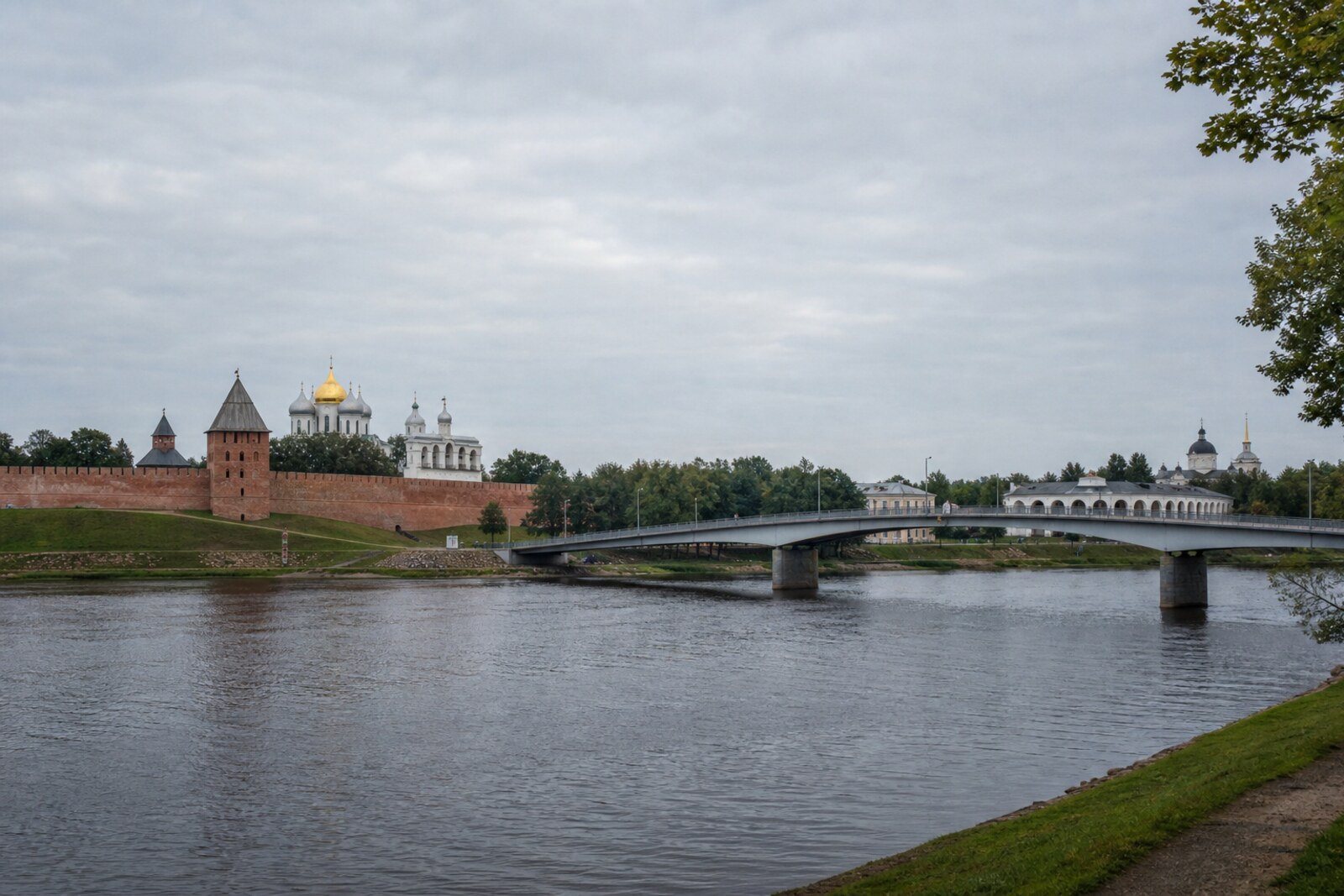 Novgorod Kremlin and St Sophia Cathedral on one bank of the Volkhov River, Yaroslav's Court on the other, and a notional image of the Great Bridge between them.