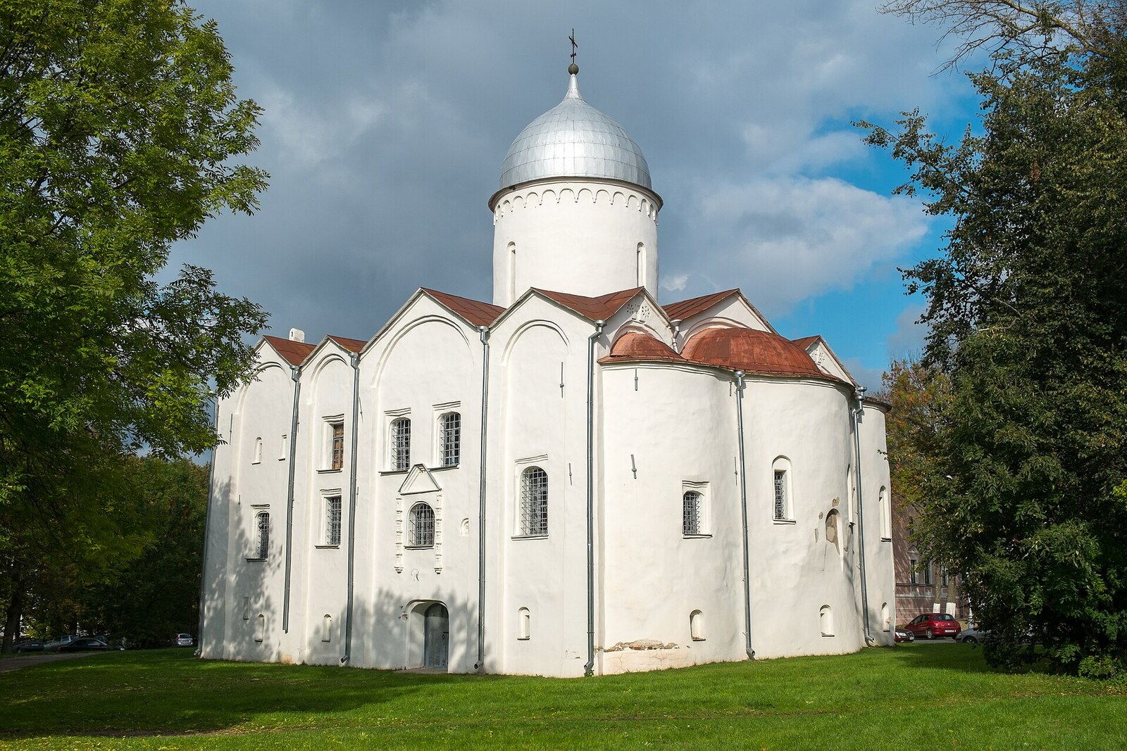 The Church of St John the Baptist at Opoki with a silvery dome and rounded apses.