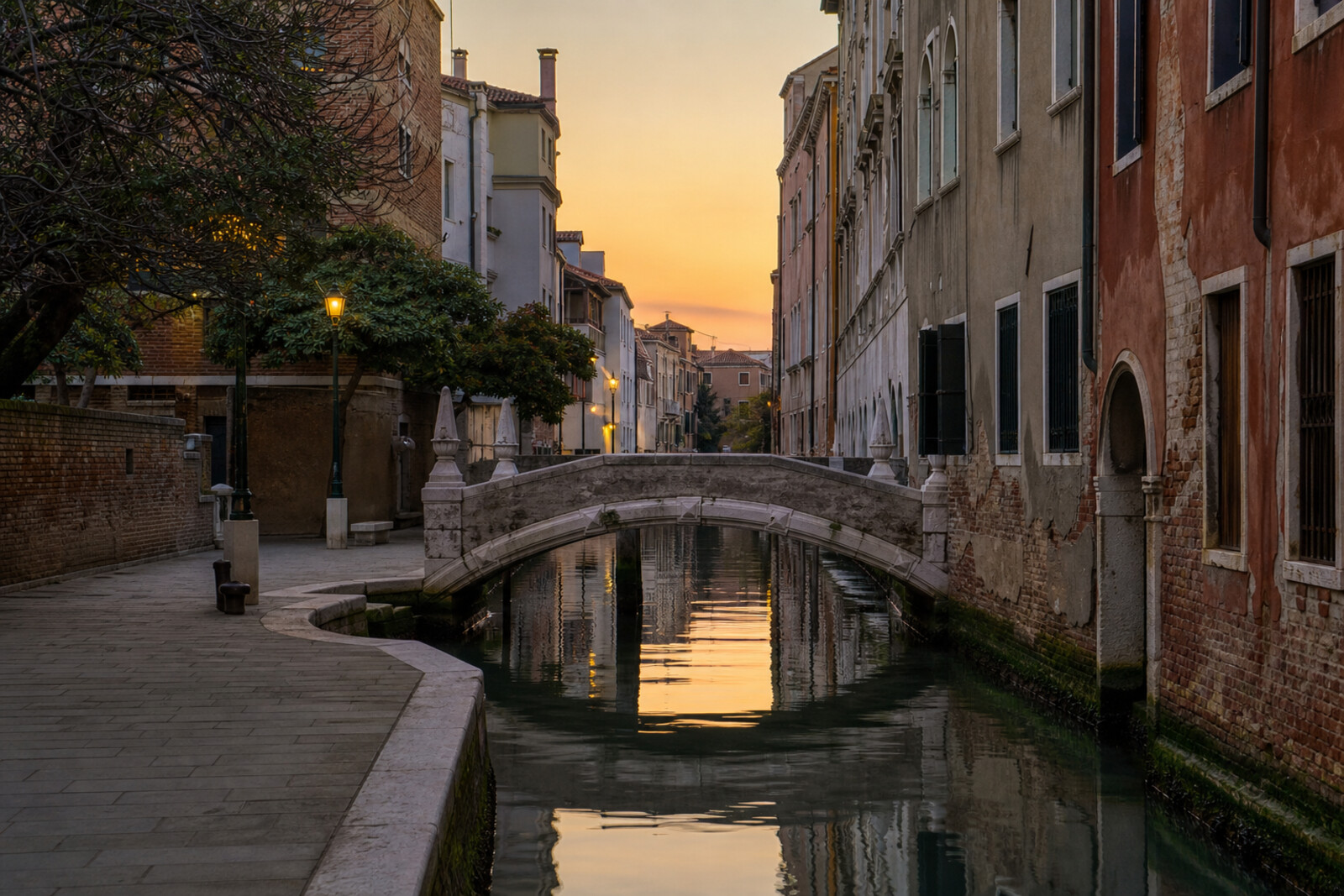 Evening view of a canal and bridge with spires in northern Cannaregio, Venice