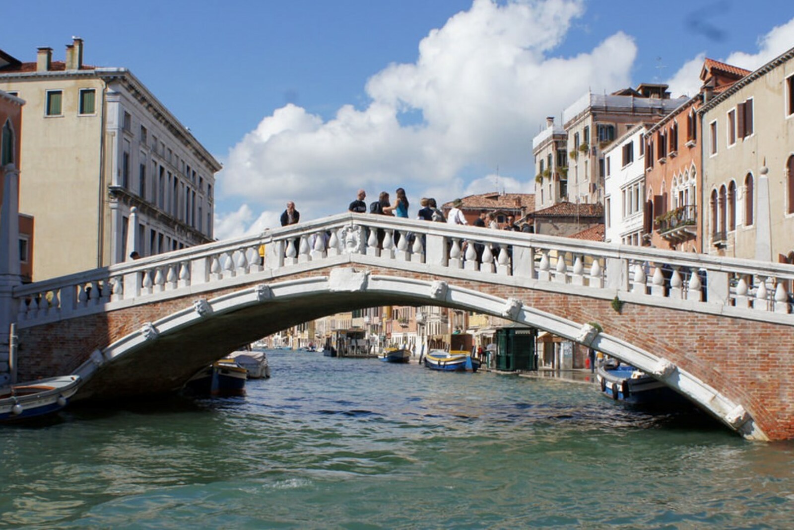 The stone Ponte delle Guglie bridge with spires above the Cannaregio Canal