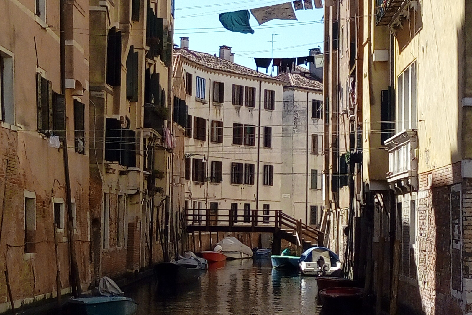 Canal by Fondamenta degli Ormesini, with houses and trees along its banks