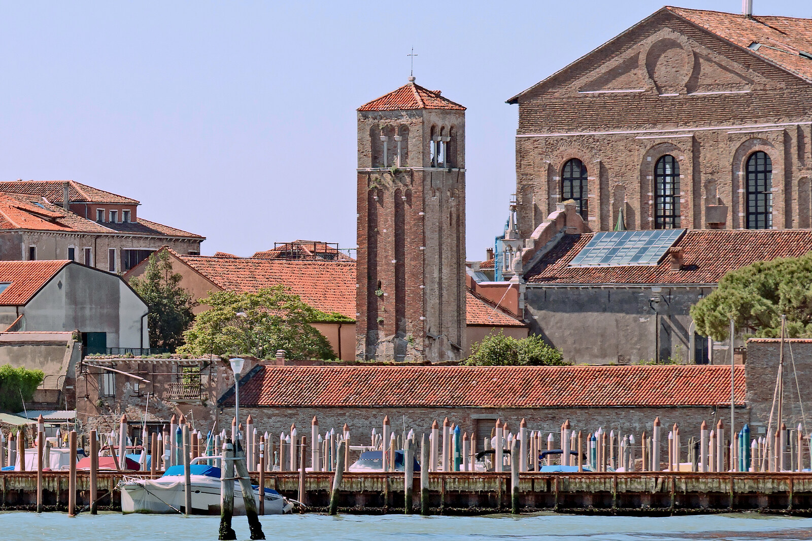 Brick bell tower and the former Abbazia della Misericordia building