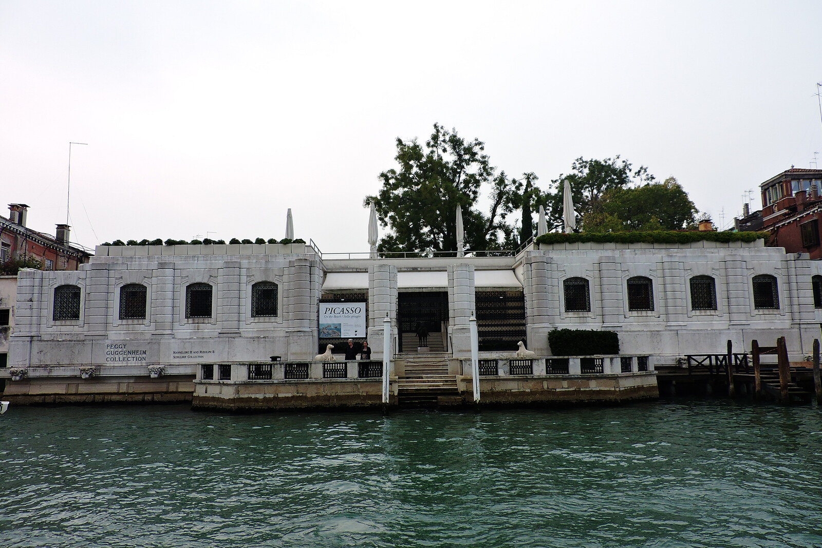 The white, one-story Palazzo Venier dei Leoni on the canal bank, home to the Peggy Guggenheim Collection.