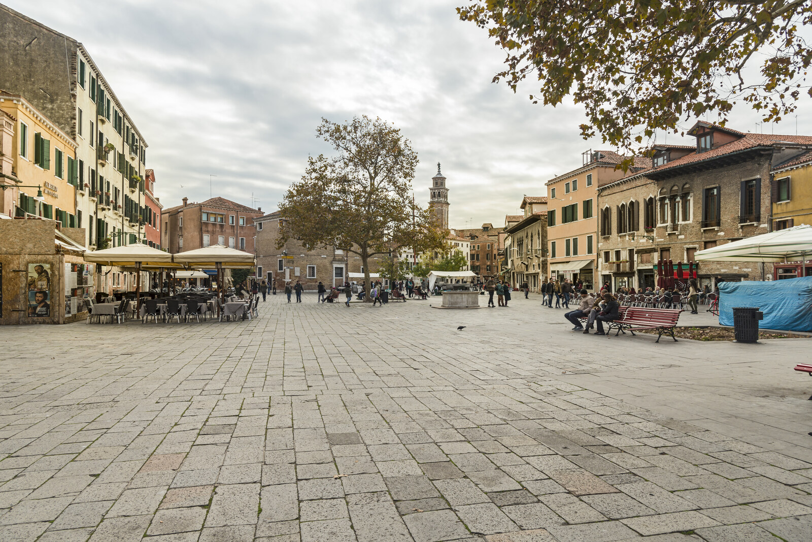 The large Campo Santa Margherita square, with people sitting at cafés and walking across the stone pavement.