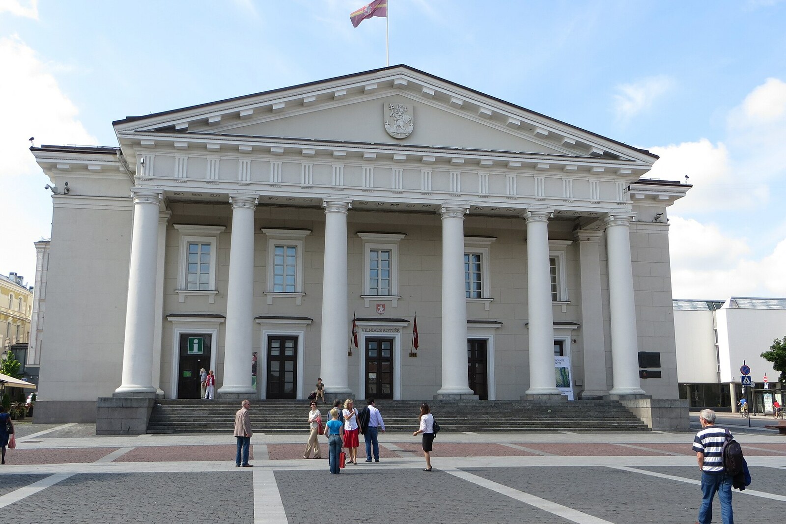 The white neoclassical façade of Vilnius Town Hall with six columns.