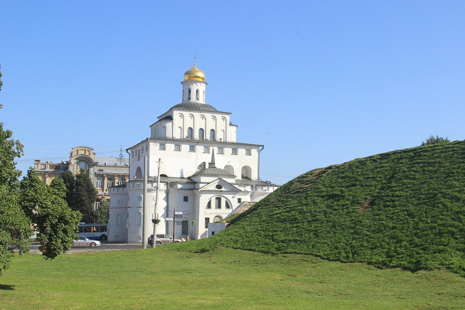 Kozlov Rampart beside the Golden Gate, with a view of the earthen ridge and the white-stone arch.