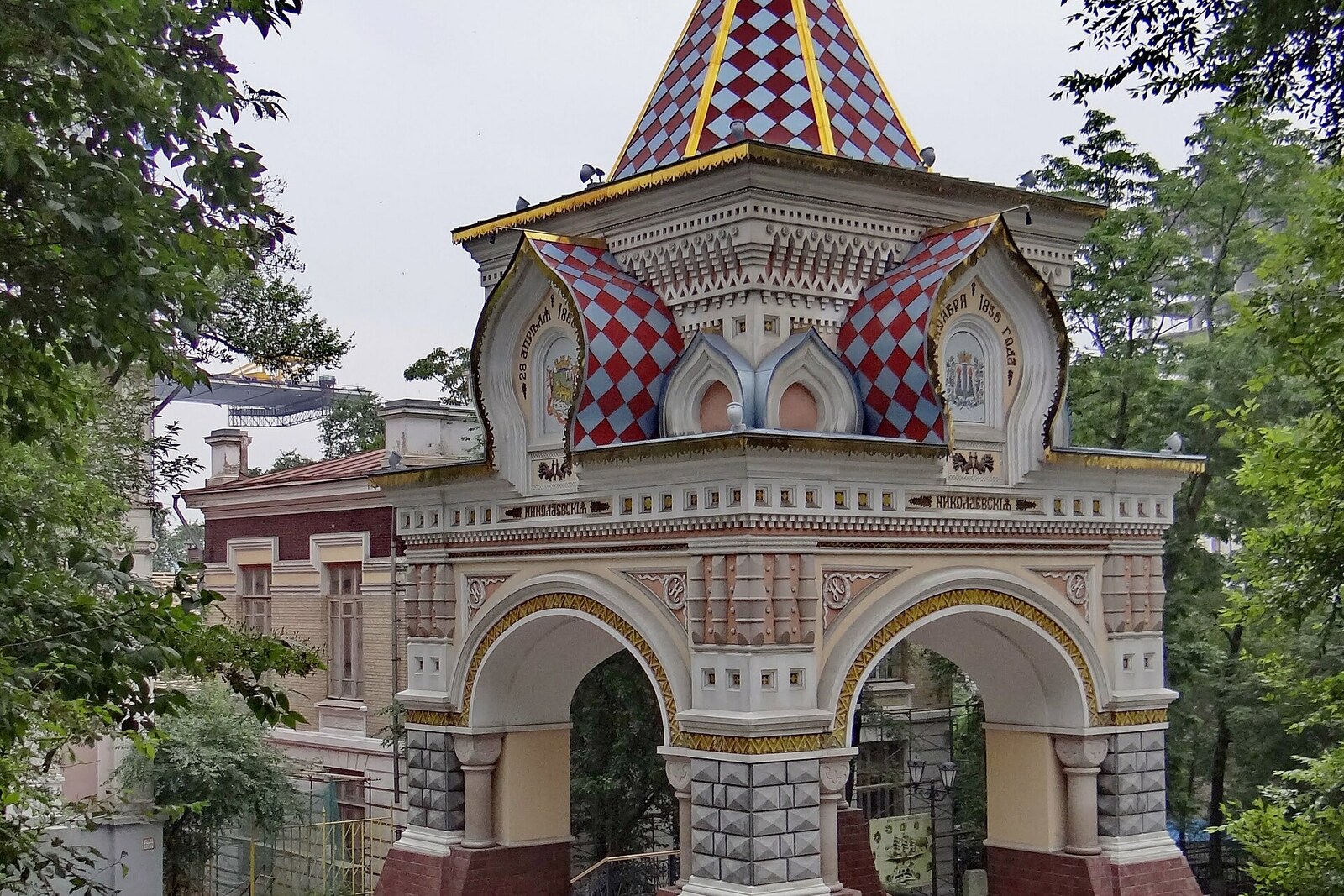 A brick Tsarevich arch with a tented roof in Admiralsky Park.