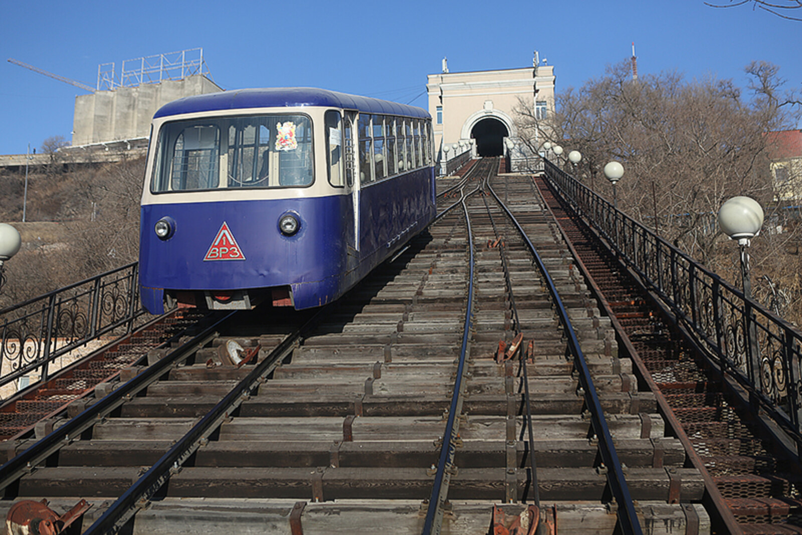 Two cars of the Vladivostok Funicular on inclined tracks.