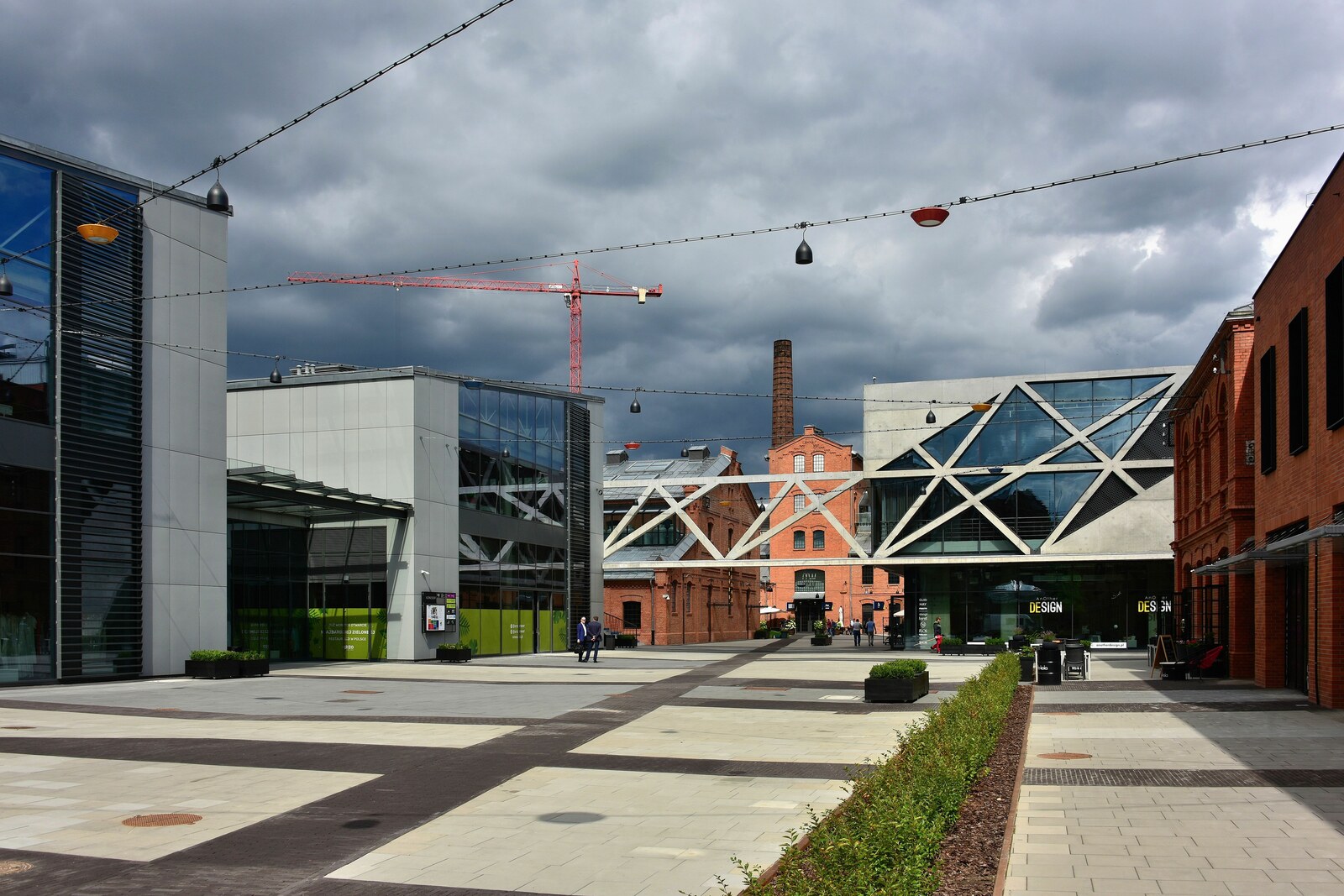 The red-brick Koneser factory complex with a chimney and courtyard