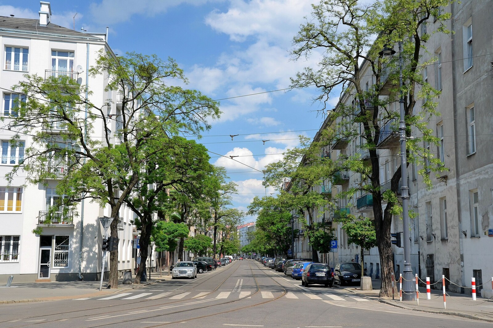 Historic cobbled Stalowa Street with brick façades and rails