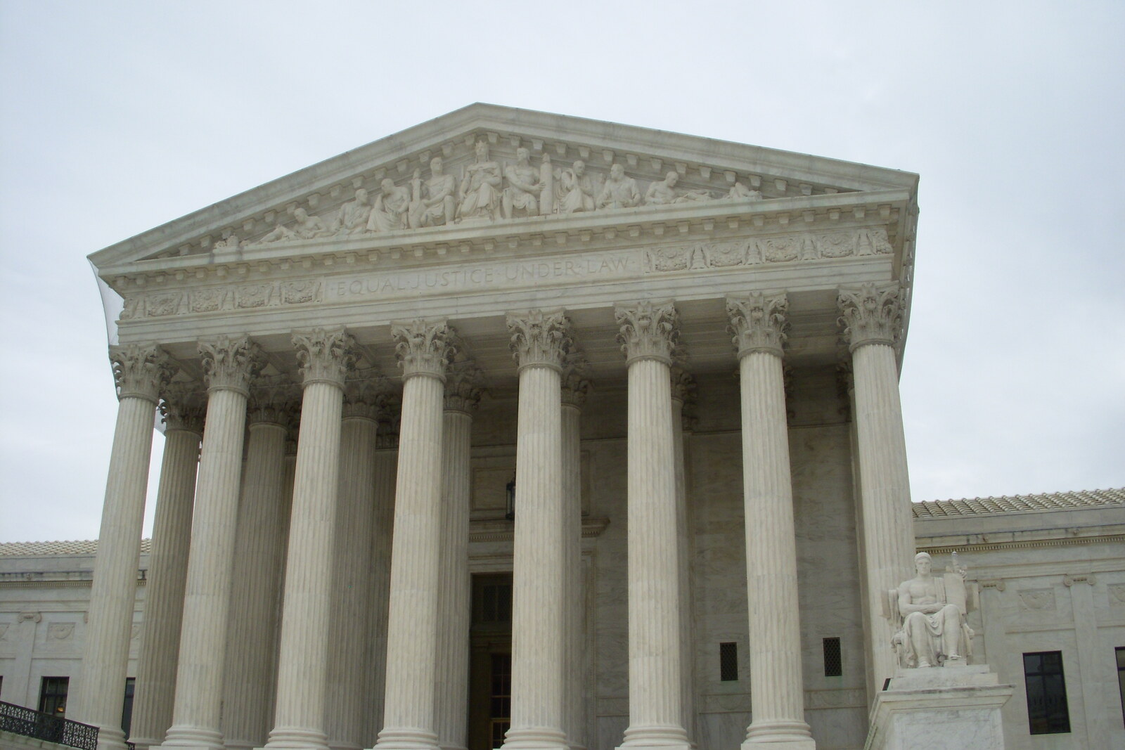 The white marble facade of the U.S. Supreme Court, with columns and steps.