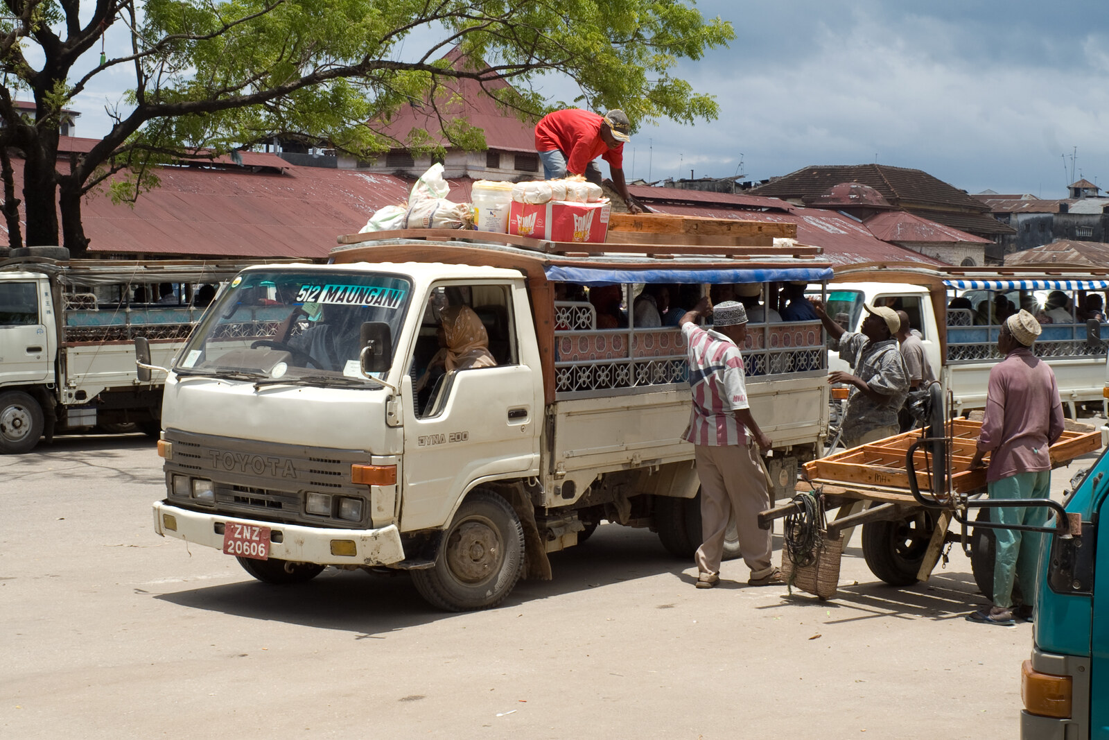 Dala-dala terminal in Stone Town with minibuses and passengers