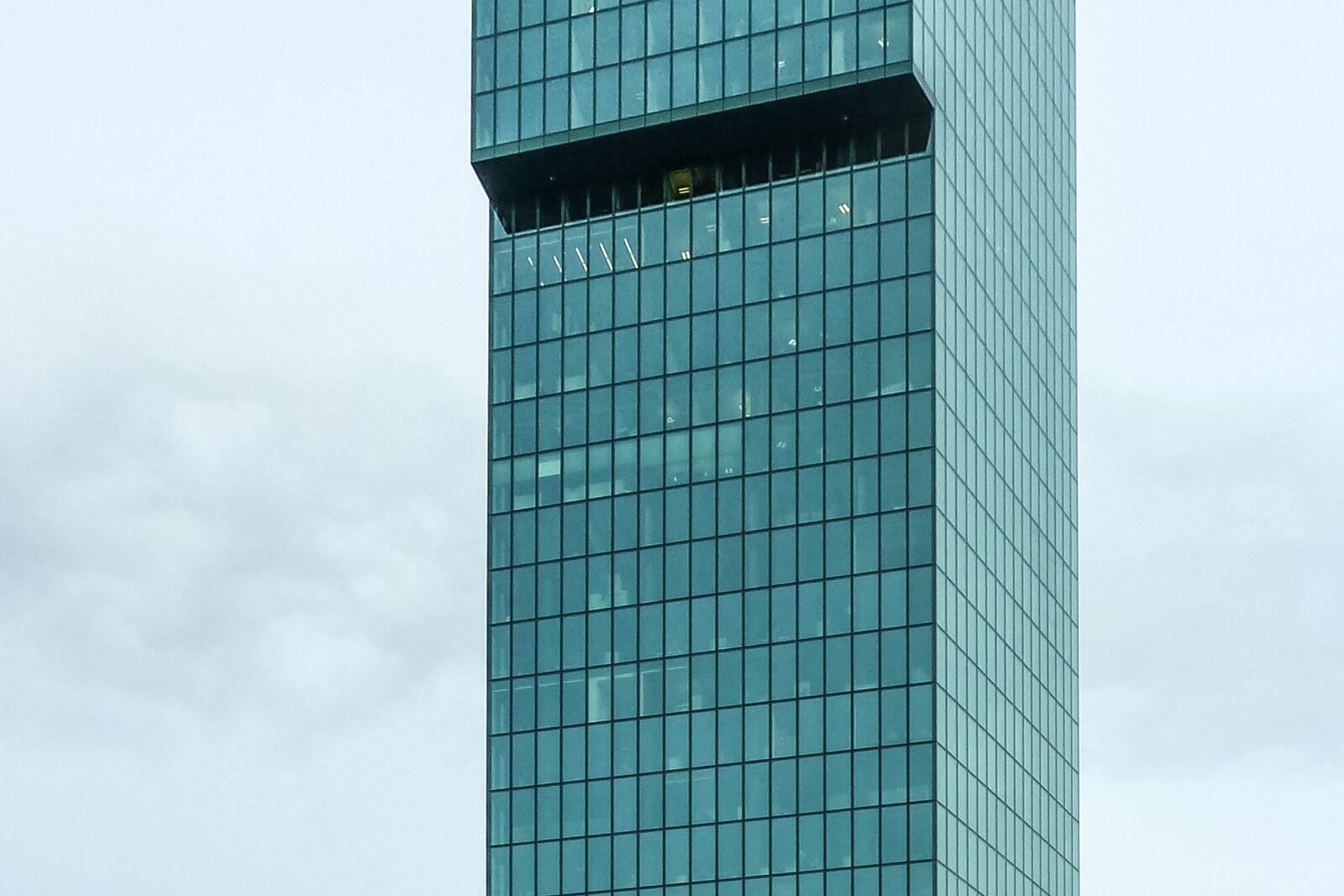 The tall glass Prime Tower against the sky